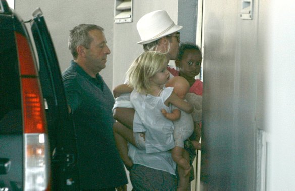 Brad Pitt arrives at the Lenval Hospital in Nice, France, carrying his children Zahara, right, and Shiloh, in 2008 before Angelina Jolie gave birth to her twins. 