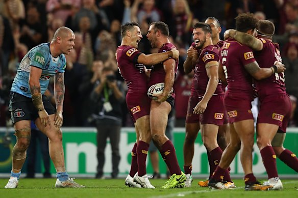 Cameron Smith and Cooper Cronk of the Maroons celebrate winning game three of the State Of Origin series.