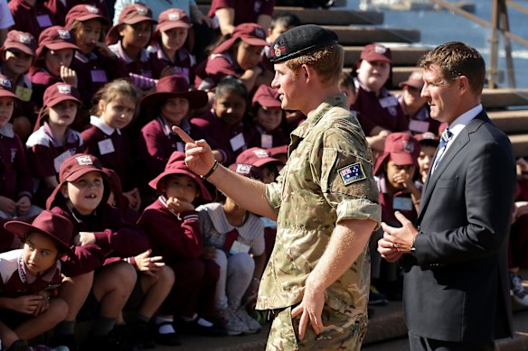 Prince Harry and Premier of New South Wales Mike Baird (R) meets school children at the Sydney Opera House 
