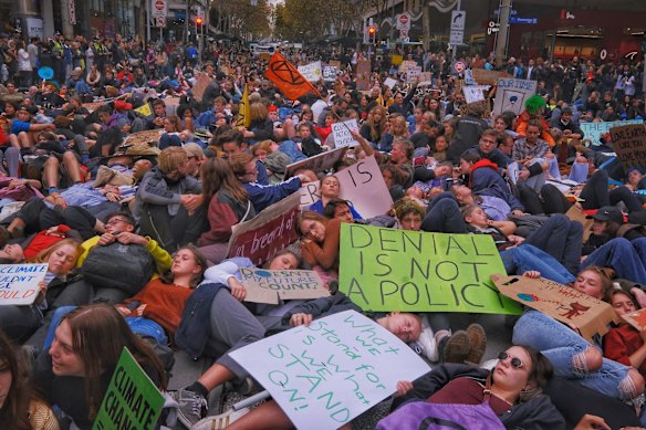 Protesters take part in the Climate Emergency XR Snap Rally in Melbourne.