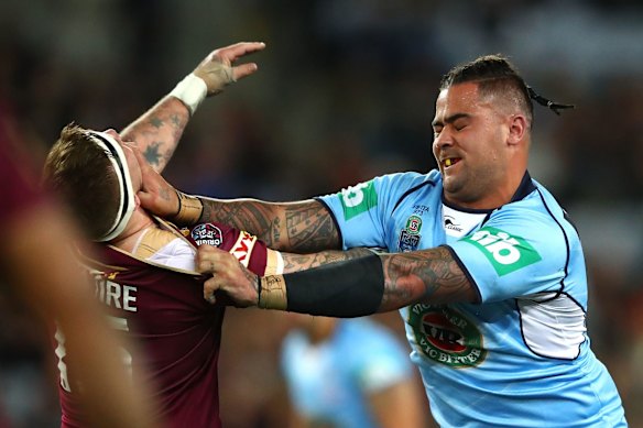 Andrew Fifita of the Blues fends off Josh McGuire of the Maroons.