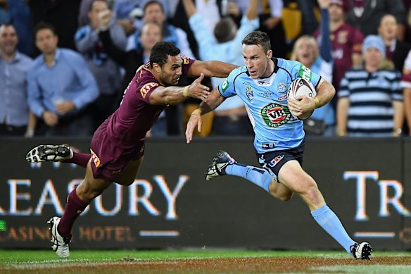 BRISBANE, AUSTRALIA - JUNE 22: James Maloney of the Blues runs in for a try during game two of the State Of Origin series between the Queensland Maroons and the New South Wales Blues at Suncorp Stadium on June 22, 2016 in Brisbane, Australia.  (Photo by Matt Roberts/Getty Images)