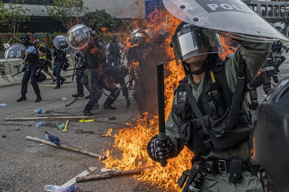 Protesters clash with police officers in Kowloon Bay in Hong Kong, Aug. 24, 2019. 