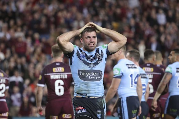 James Tedesco of the Blues reacts after Dane Gagai's try.
