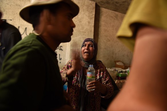 A woman overcome with shock is treated by medics in a field hospital in West Mosul.