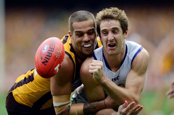 Michael Barlow and Lance Franklin go for the ball.