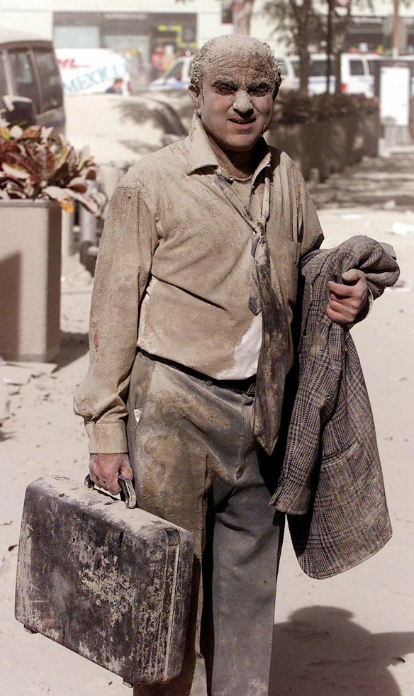 A man walks in the street following attacks on the World Trade Center towers in New York City, in this September 11, 2001 photo.
