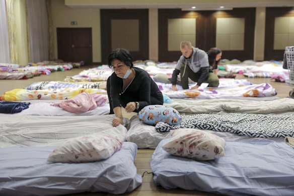 Polish local hospital employees and volunteers make hundreds of beds to prepare for an influx of Ukrainian refugees in Rzeszow, Poland.