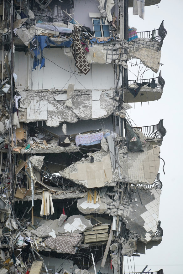 A number of homes in the still-standing part of the apartment building were left exposed.