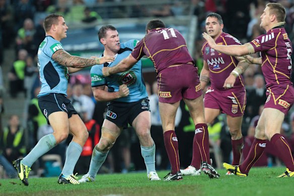 Nate Myles and Paul Gullen fight during the first half.
