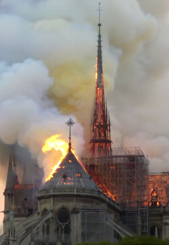 The spire and parts of Notre Dame cathedral is on fire.