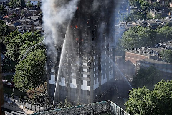 Firefighters tackle the building after a huge fire engulfed the 24-storey Grenfell Tower in Latimer Road, West London. 