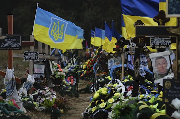 Ukrainian flags fly above the graves of soldiers from the Ukrainian Armed Forces at the Matviyivka cemetery. Many belonged to the Mykolaiv Battalion.