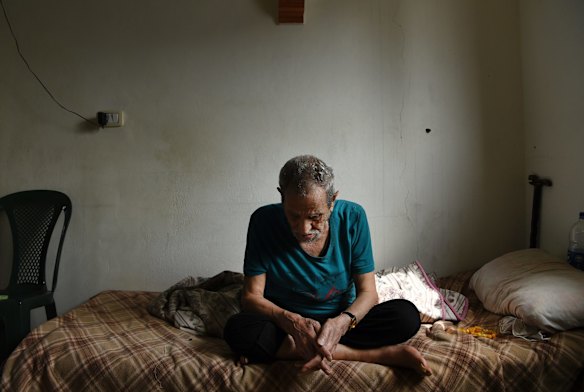 Syrian refugee Sobhi al-Deraai who is ill and receives medical visits from MSF, sits on his bed in his family's apartment they rent in Ain al-Hilweh a Palestinian refugee camp in Sidon, Lebanon. 