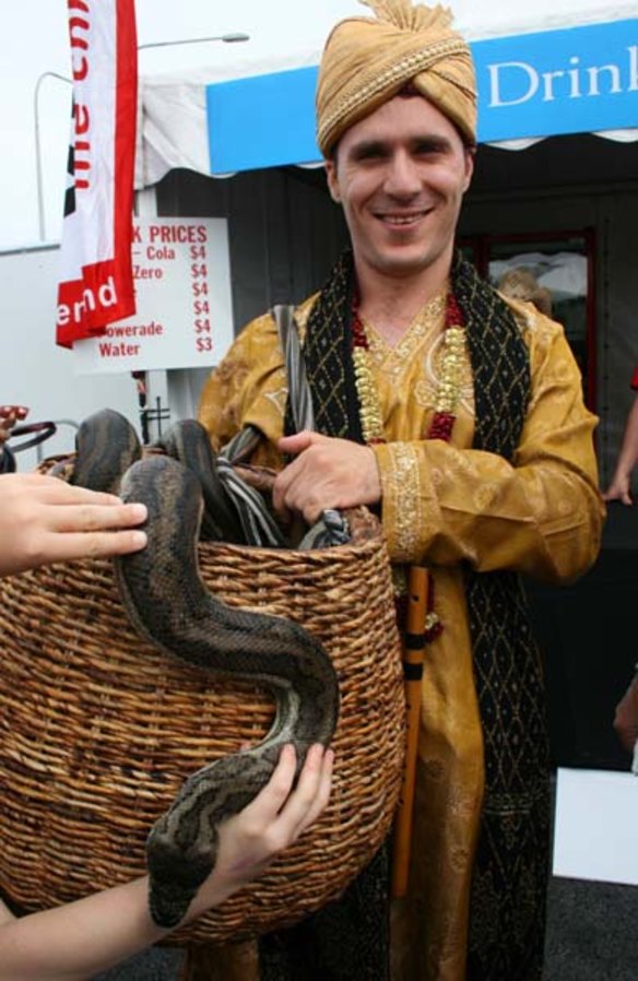 Johnny The Jester with carpet snake Luna.