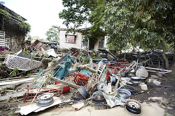 Emergency services search for bodies in the town of Grantham, in the Lockyer Valley, which was devastated by a sudden flood on January 10. Photo: Dean Saffron
