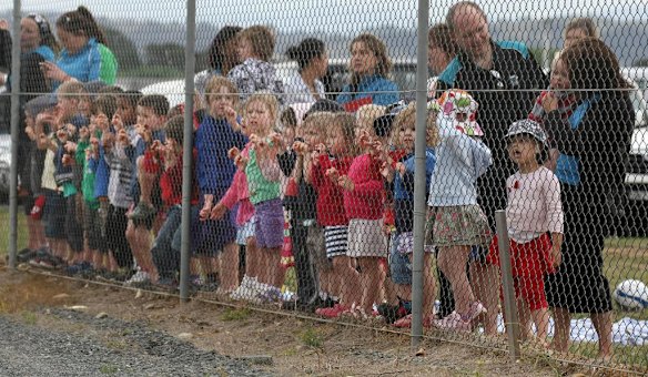 School children watching Air force one land at Canberra airport this afternoon.