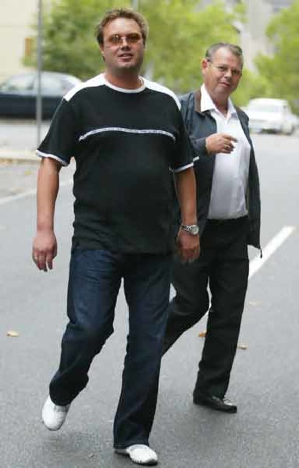 Carl Williams arrives at court with father George in April 2004.