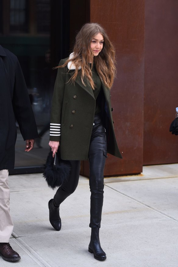 Gigi Hadid does a simple khaki coat with dark denim.