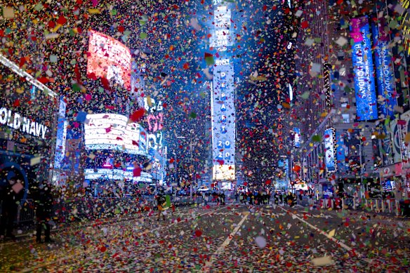 The Times Square New Year's Eve Ball drops as confetti flies in an empty Times Square as the area normally packed with revelers remained closed off due to the ongoing coronavirus pandemic.