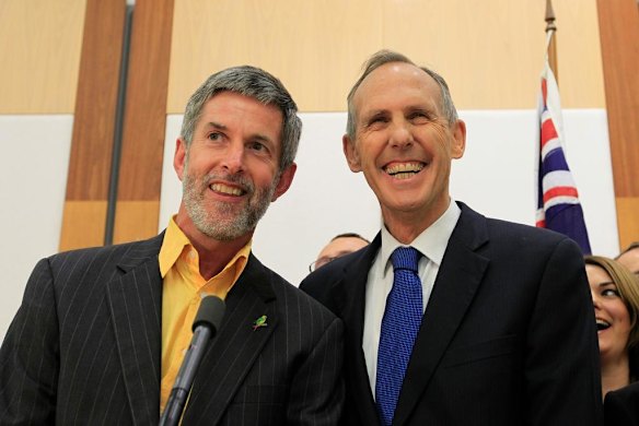 Bob Brown with his partner Paul Thomas after announcing his resignation from the Senate.
