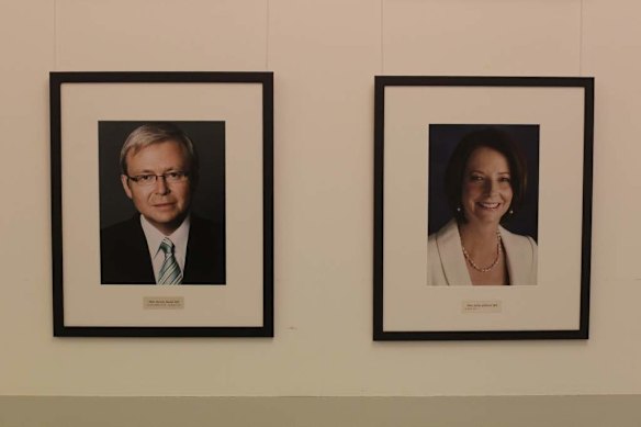 Portraits of Prime Minister Julia Gillard and other former Prime Ministers appear in the Caucus room at Parliament House.