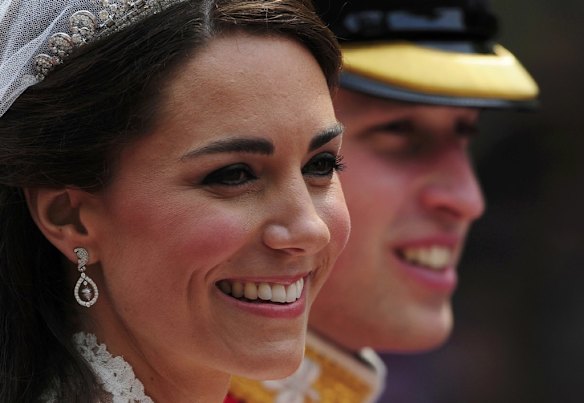 Britain's Prince William and Catherine, Duchess of Cambridge travel to Buckingham Palace, along the Procession Route, after their wedding in Westminster Abbey.