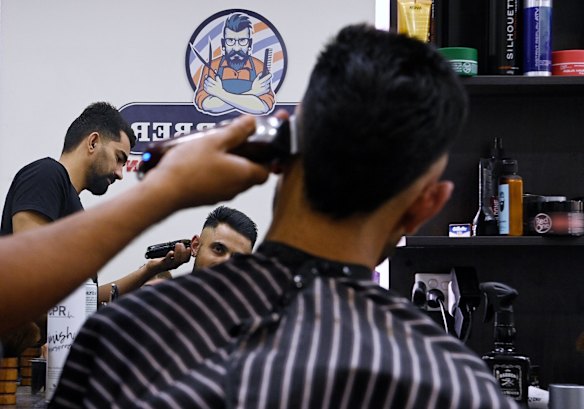 Prince Singh gets a short back and sides.