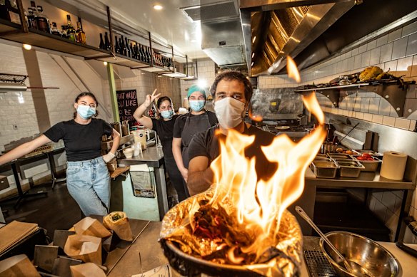 Afik Gal and the crew at Miznon in Hardware Lane are ecstatic abouth opening up again. Seen here burning sage to cleanse the restaurant before reopening. 