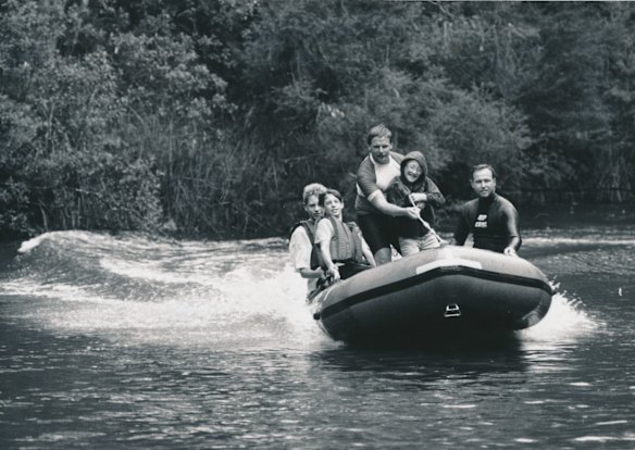 Surf life-savers Steve Leahy and Brian Happ introduce Sergei Yeromenko and Scouts Russell Davies and Nick Duell to "rubber ducky" riding. The 42 Kiev children were guests of the Victims of Chernobyl National Relief Fund and stayed with Australian families for more than a month. Photo: Michael Clayton-Jones


