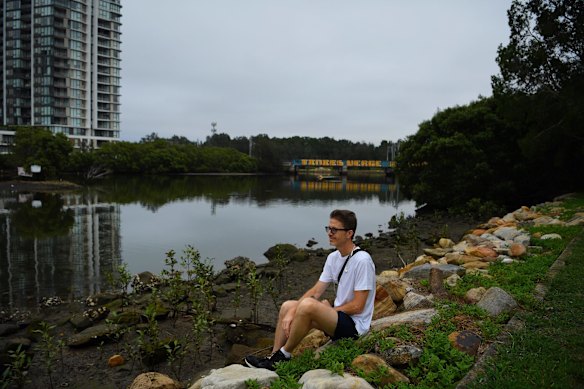 Michael Thompson, 48, sits by the waters edge on the Cooks River at Kendrick Park in Tempe.  Michael loves the Cooks River and has had a relationship with it for 15 years - going for morning walks along the banks and visits with his family.
