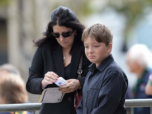 Friends and relatives arrivie for the service.