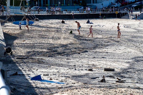People are back in the water at Bondi Beach, but there is much to clean up.
