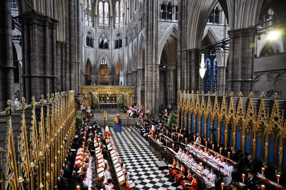 The coffin of Queen Elizabeth II, draped in the Royal Standard, lying at Westminster Abbey.