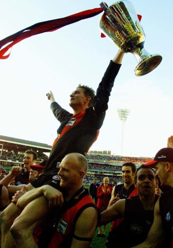 Captain James Hird holding 2000 premership cup.