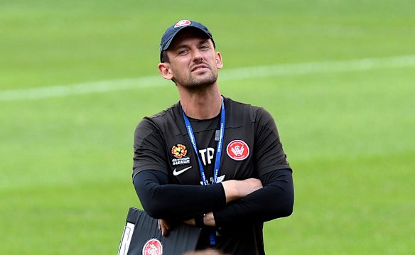 Coach Tony Popovic watches on during a Western Sydney Wanderers A-League training session at Suncorp Stadium.