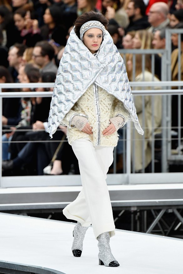 With no gravity in space, Lagerfield's solution to the freezing conditions includes metallic space blankets, suits, trousers and sparkles that were all matched with knit wraparound headbands and gravity-defying hair.