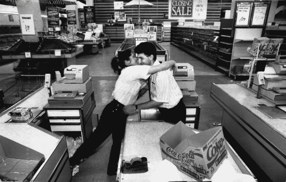 Staff members Tina Papadatos and Peter Adam say goodbye on November 8, 1992.