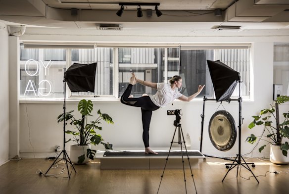 Faces of the cancelled economy. Small business owner, Casey, owns a yoga studio is beginning to do online Yoga classes, due to coronavirus.