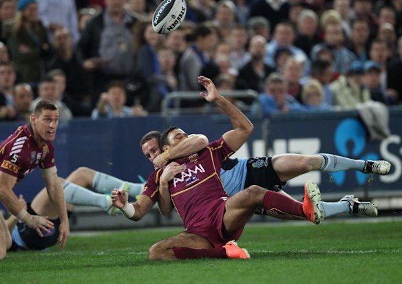 Justin Hodges gets taken high.