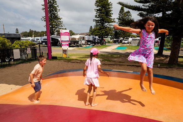 Children enjoying the jumping pillow at Toowoon Bay Holiday Park on the Central Coast, which has had more bookings since the beginning of the COVID-19 crisis.
