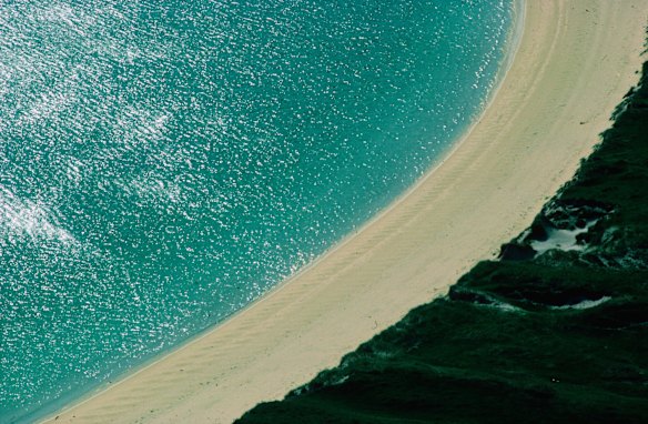 Vatersay Bay, Scotland: A good beach doesn't have to be tropical. If you can forgo the urge for a swim and instead just appreciate the beauty of pristine sand, grass-covered dunes, and the rugged, windswept hills that surround them, then you'll be in paradise at Vatersay Bay in Scotland's Outer Hebrides. This beautiful beach is linked to the Isle of Barra by a new causeway – however, that doesn't mean you're likely to encounter too many people at this far northern outpost.