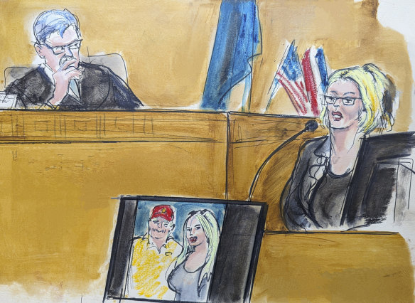 In this courtroom sketch, Stormy Daniels testifies on the witness stand as Judge Juan Merchan looks on.