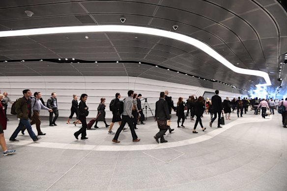 Early morning commuters start using the walkway.