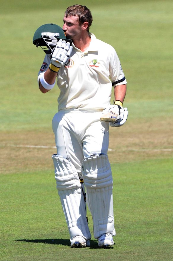 Phillip Hughes kisses the badge on his helmet after celebrating his 100 runs during day one of the Second Test between South Africa and Australia played at Kingsmead on March 6, 2009 in Durban, South Africa.