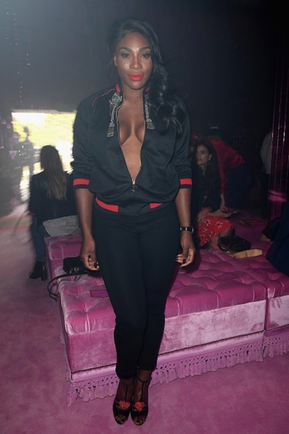 Serena Williams rocked the perfect sport luxe look at the Gucci show, wearing an embellished track top with red details and matching shoes.