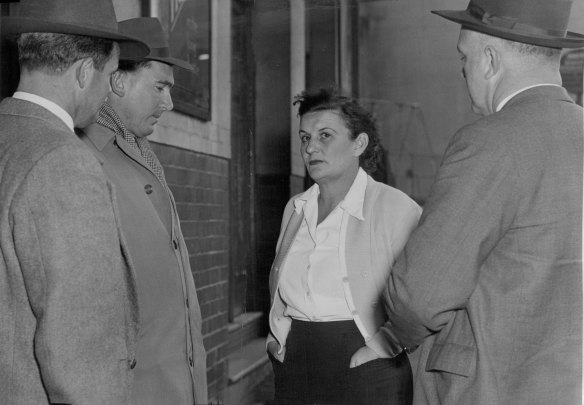“Mrs. J. Thorn, Manageress of the Australian Hotel, being interviewed by homicide detectives at the scene of last night’s shooting. June 9, 1956.”