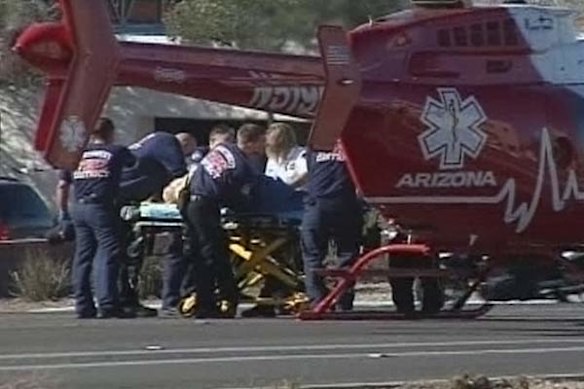Emergency personnel airlift the wounded following the shooting.
