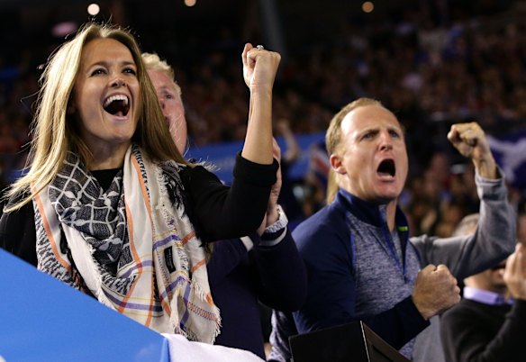 Kim Sears, fiancee of Andy Murray of Britain, left, and team members clench fist during Murray's men?s singles final against Novak Djokovic of Serbia at the Australian Open tennis championship in Melbourne, Australia, Sunday, Feb. 1, 2015.  