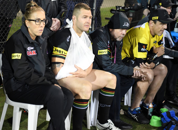 Frustrated spectator: Trent Merrin watches from the sidelines on Friday night.